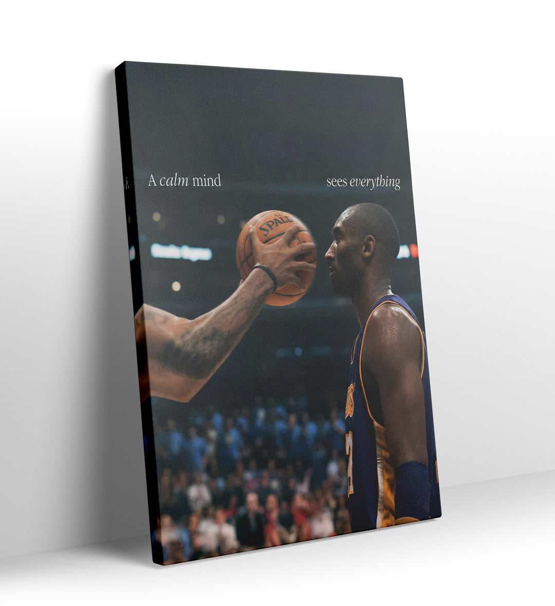 Kobe Bryant staring intensely at a basketball with "A calm mind sees everything" text canvas wall art.