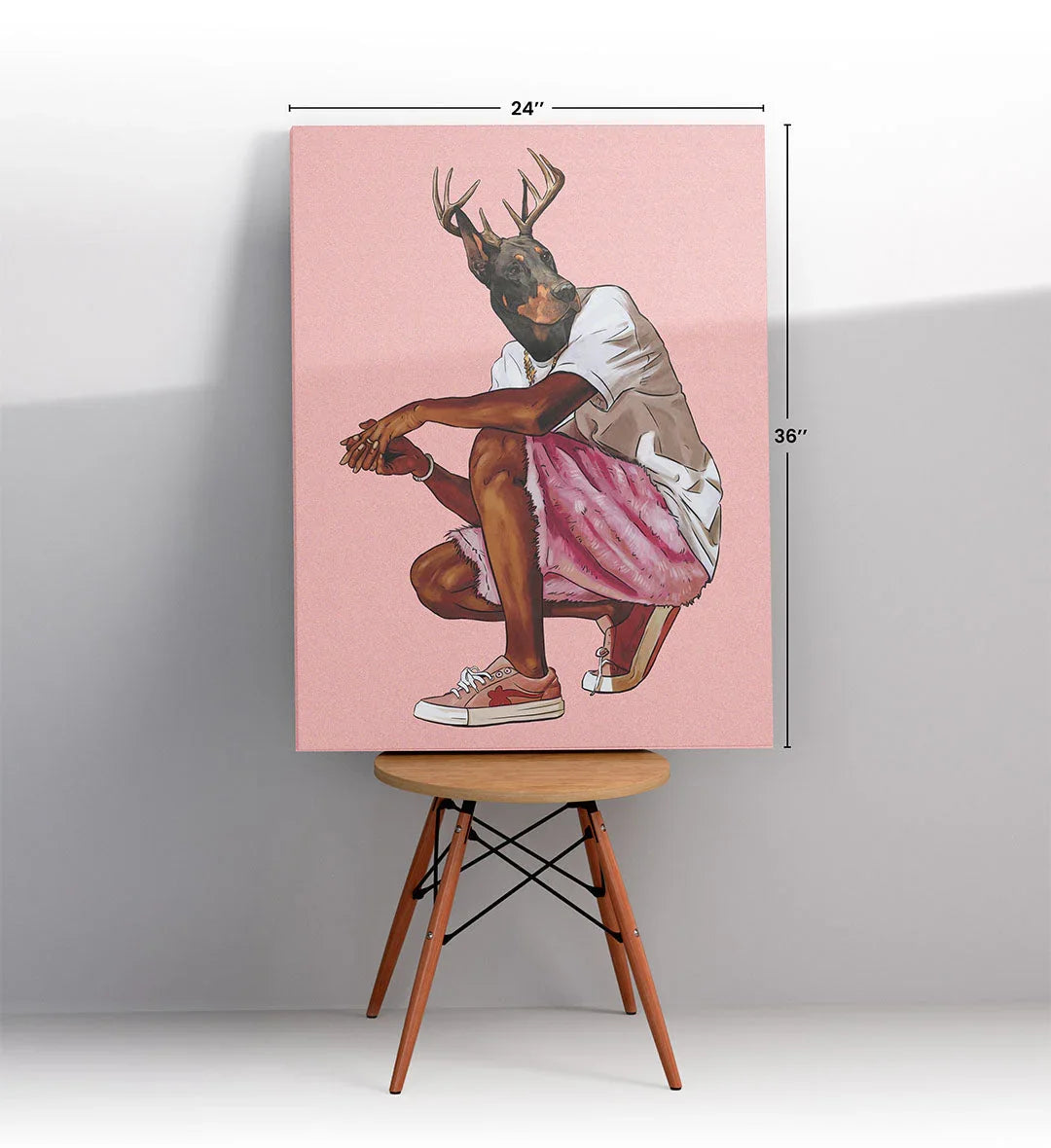 Canvas print of a dog with deer antlers on a pink background.