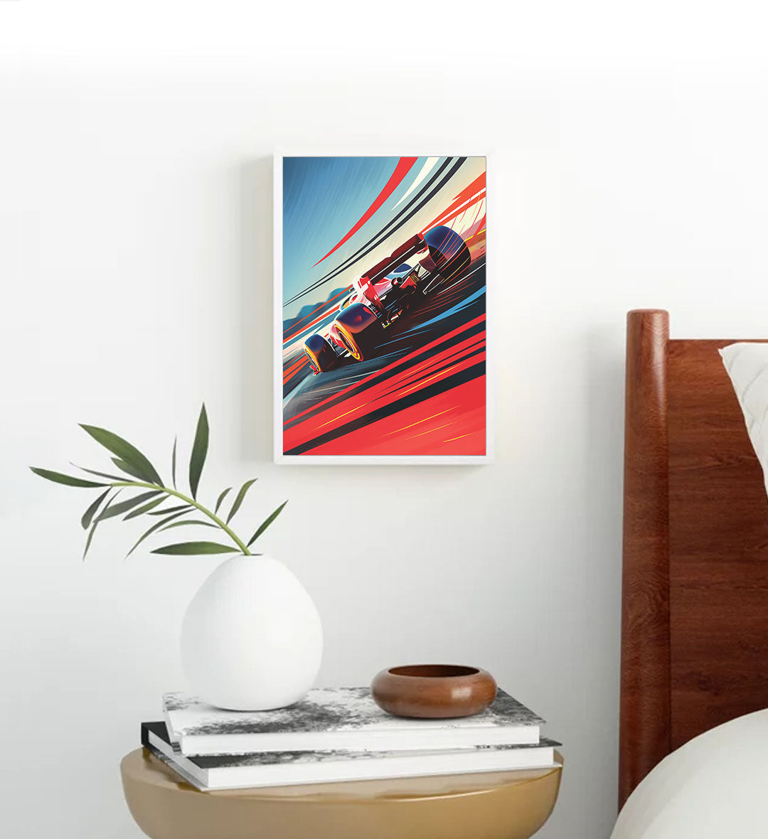 Framed artwork of a racing car on a wall above a table with decorative items.