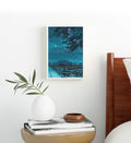 Cozy bedroom styled with blue city skyline canvas print.