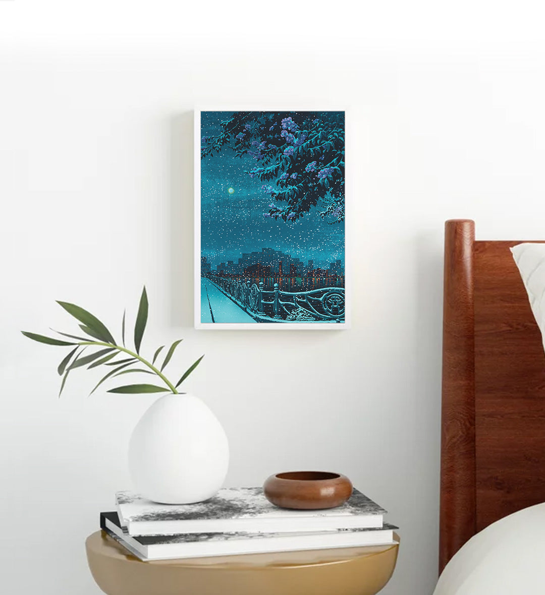 Cozy bedroom styled with blue city skyline canvas print.