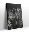 Detail of the black and white stripes and expressive faces of the zebras.