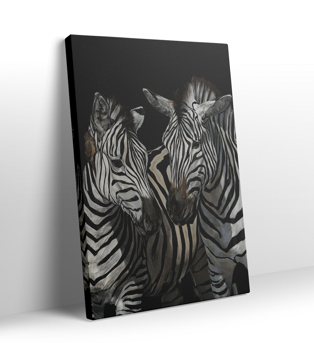 Detail of the black and white stripes and expressive faces of the zebras.