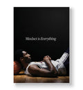 Kobe Bryant lying on the floor resting his head on a basketball with 