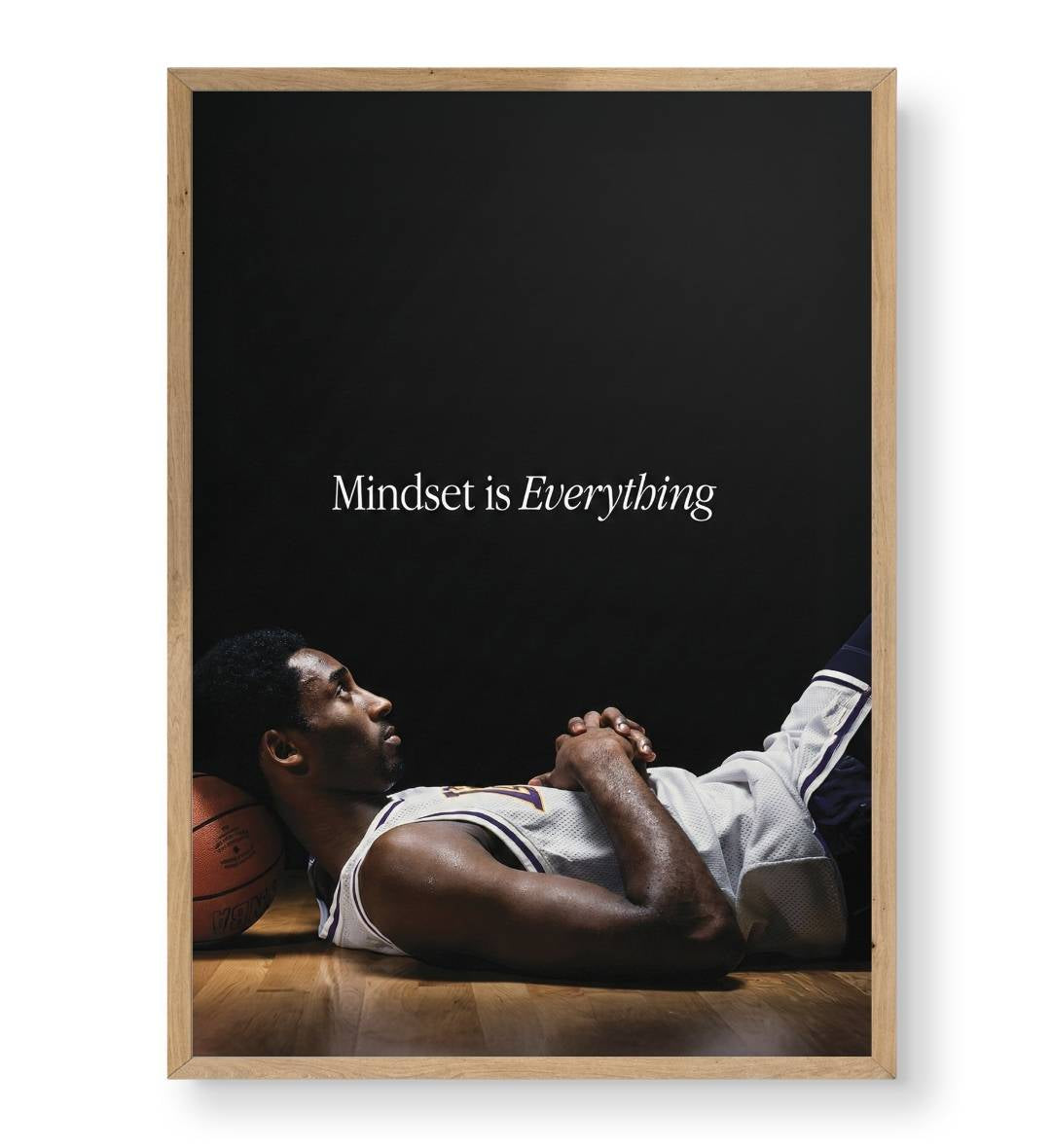 Detail of Kobe's contemplative expression and the texture of the orange basketball.