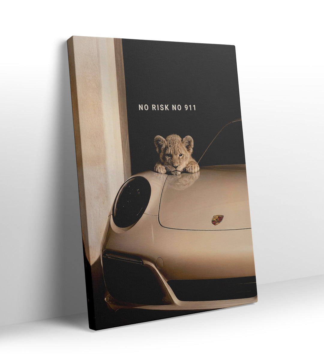 Lion cub resting paws on the hood of a cream Porsche 911 with "No Risk No 911" text canvas wall art.