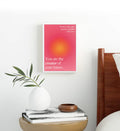 Boho living room styled with spiritual aura typography canvas print.