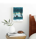 Minimalist bedroom styled with blue and green nature canvas print.
