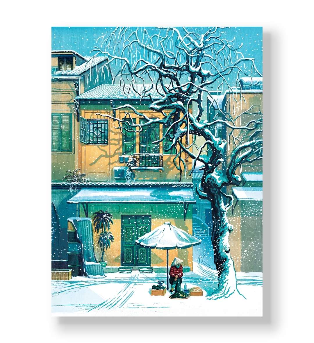 Vendor sitting under umbrella on a snowy street with yellow building canvas wall art.