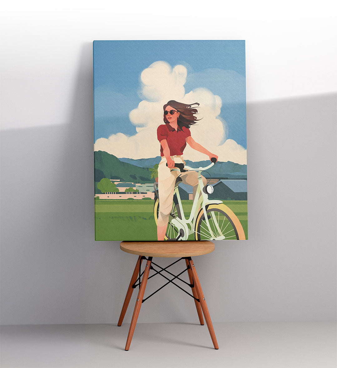 Minimalist home office with calming landscape wall hanging.