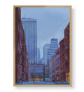 Framed artwork of a cityscape with tall buildings and a clear sky.