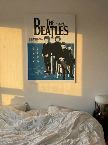 canvas of The Beatles on a wall above a bed