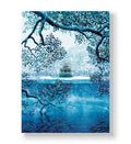 Pagoda on an island in a frozen blue lake framed by snowy branches canvas wall art.