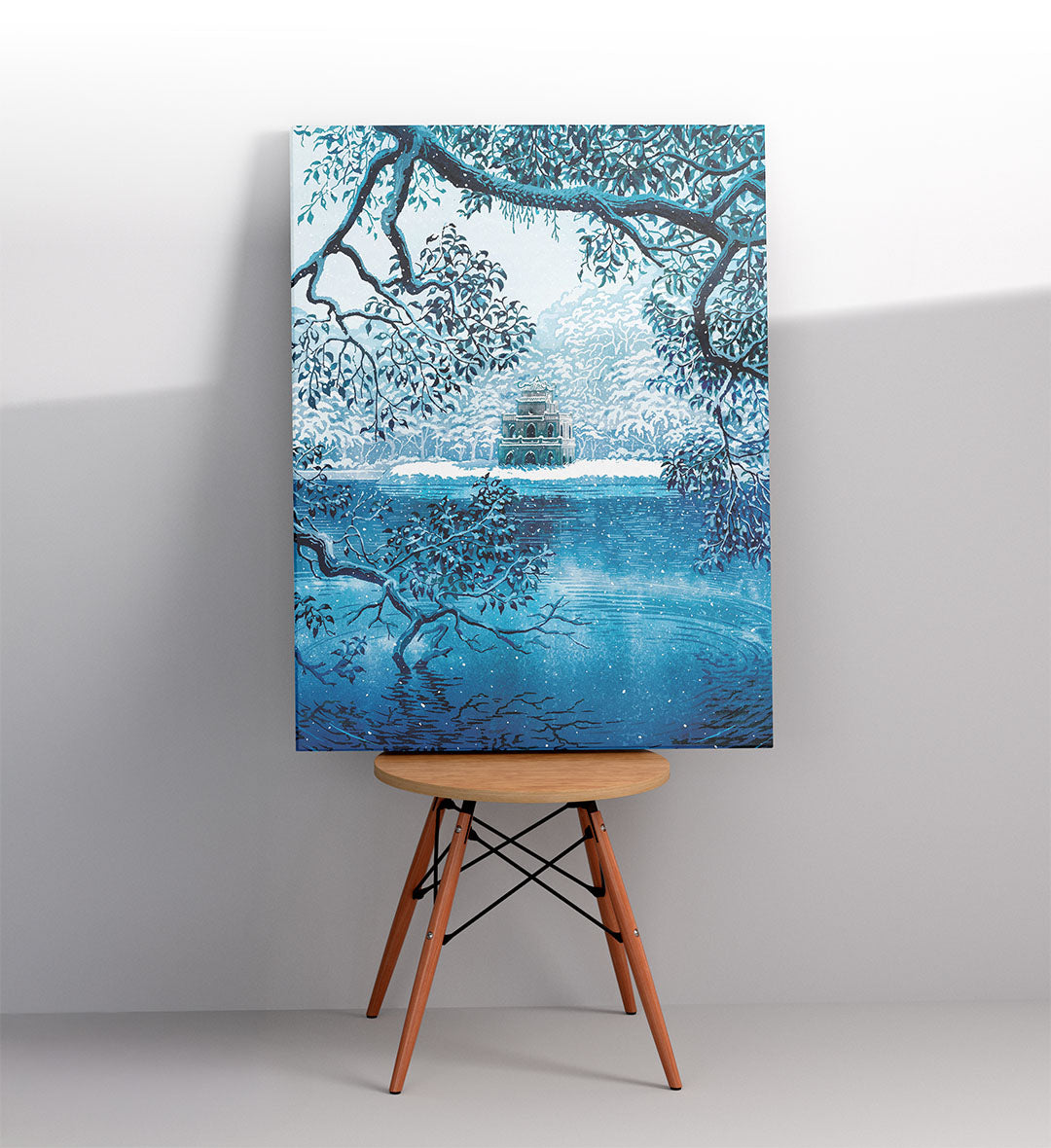 Modern bathroom wall art with calming lake and snow vibes.